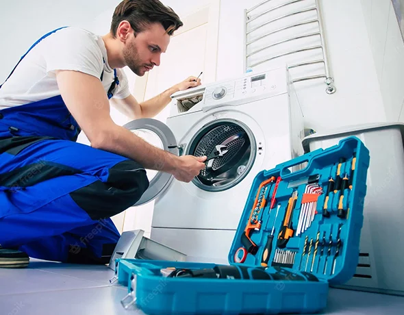 Skilled technician repairing an appliance, illustrating reliable home appliance repair in Hardinsburg IN.